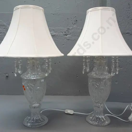pair of clear moulded glass table lamps with fluted circular foot, ring of hanging lustres and waisted, panelled shades