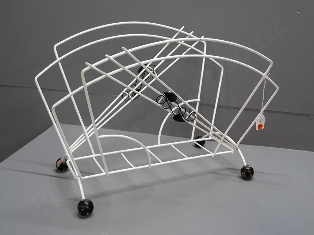 mid-century black and white metal magazine rack with applied wine leaves, black wooden ball feet - some paint loss to Image 1++