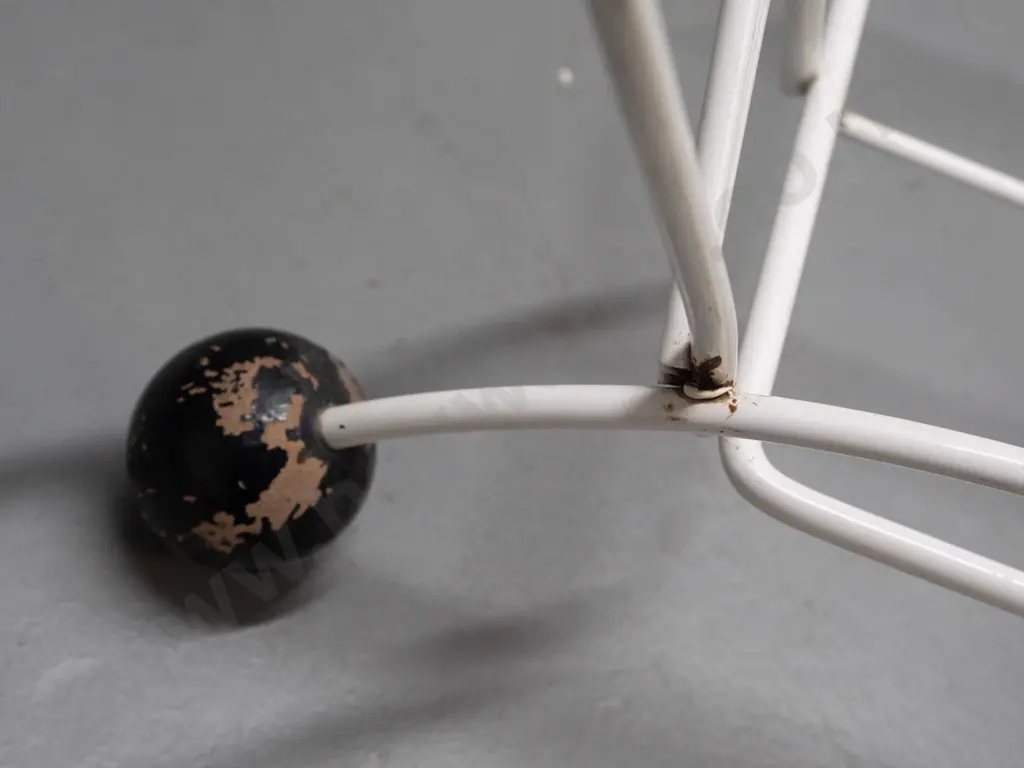 mid-century black and white metal magazine rack with applied wine leaves, black wooden ball feet - some paint loss to Image 1++