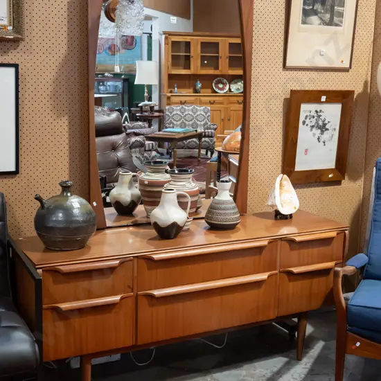 retro mahogany mirror back 6 drawer dresser. Shaped supports, original bubble glass down light -
