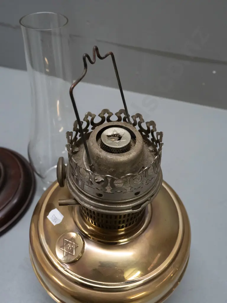 vintage kerosene lamp with clear chimney - adjusting knob, tank cap and burner have star of David logo - on turned wood Image 1++