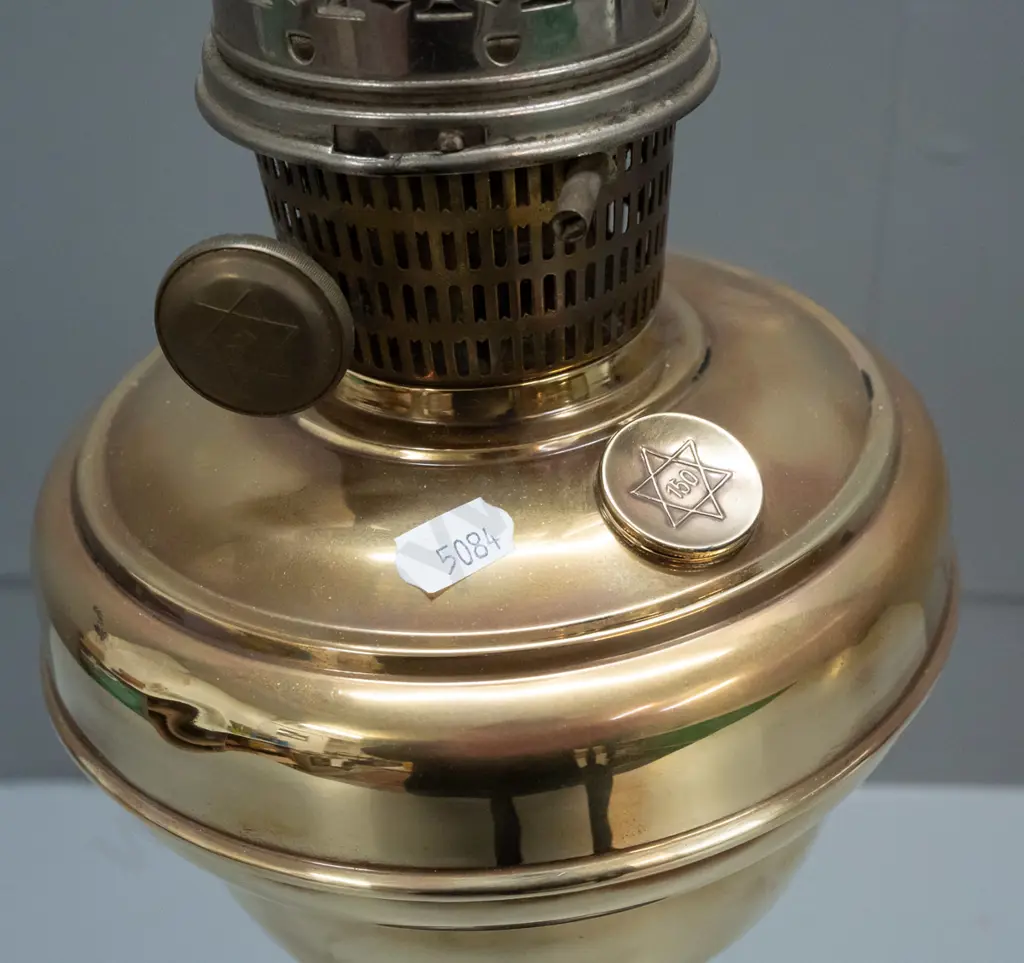 vintage kerosene lamp with clear chimney - adjusting knob, tank cap and burner have star of David logo - on turned wood Image 1++