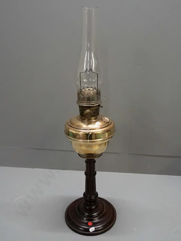vintage kerosene lamp with clear chimney - adjusting knob, tank cap and burner have star of David logo - on turned wood Image 1++