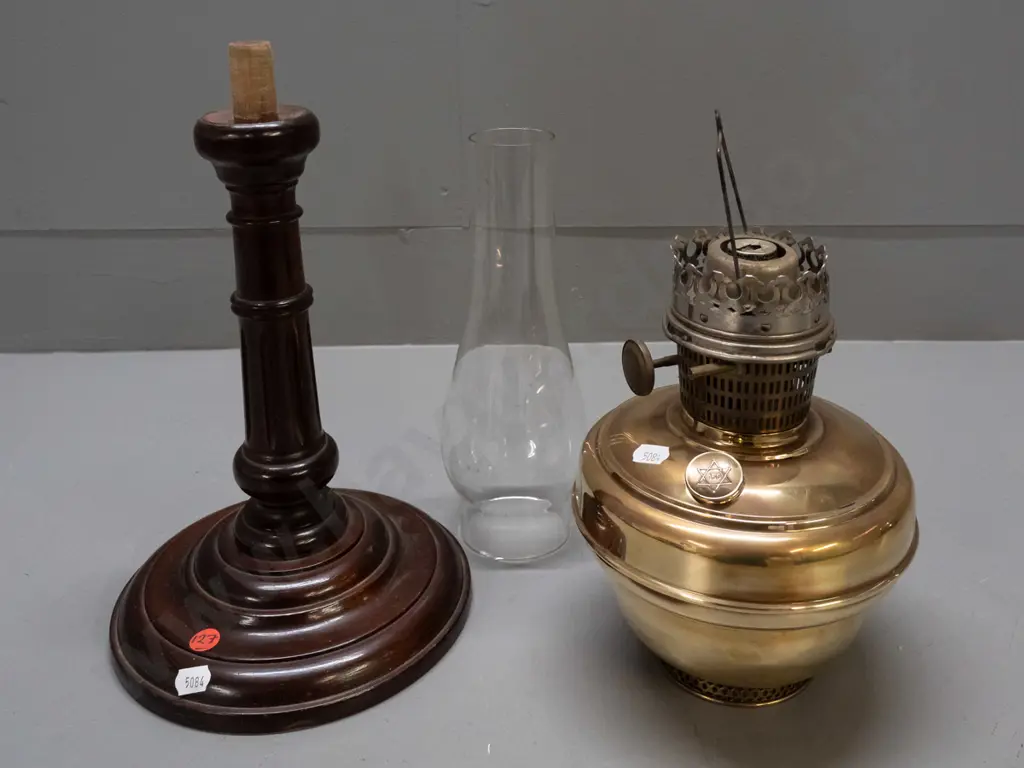 vintage kerosene lamp with clear chimney - adjusting knob, tank cap and burner have star of David logo - on turned wood Image 1++