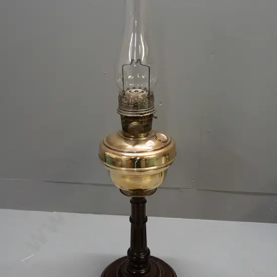 vintage kerosene lamp with clear chimney - adjusting knob, tank cap and burner have star of David logo - on turned wood