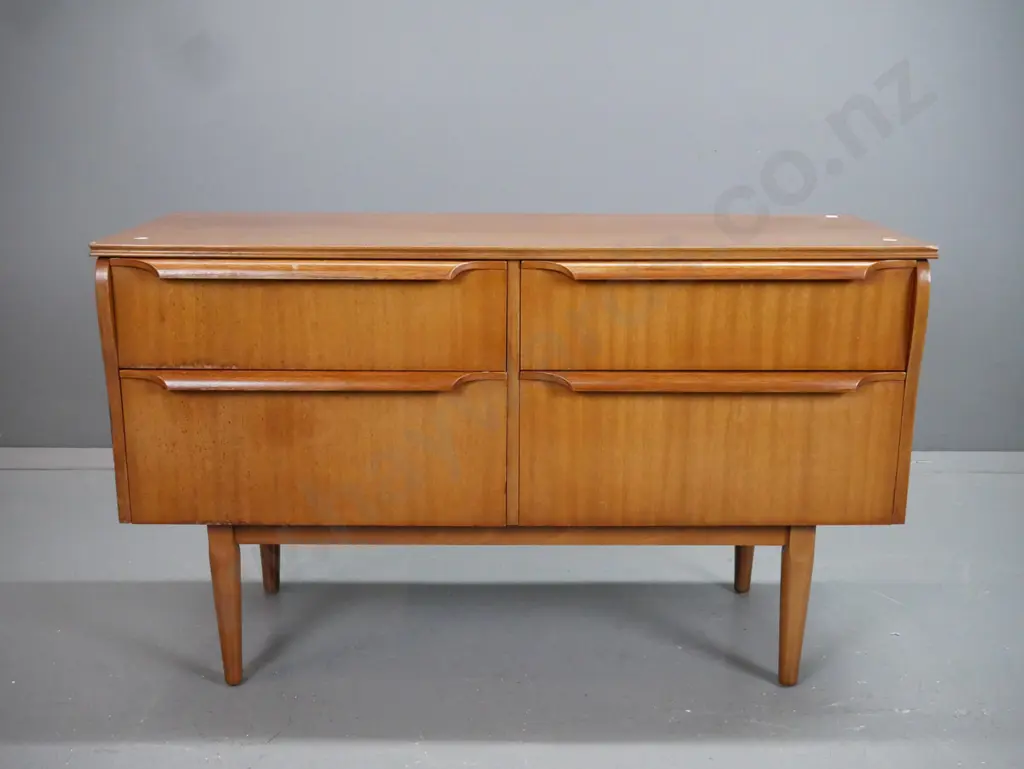 retro mahogany 4 drawer lowboy on turned tapered legs. Staining and fading to top and front. Image 1++