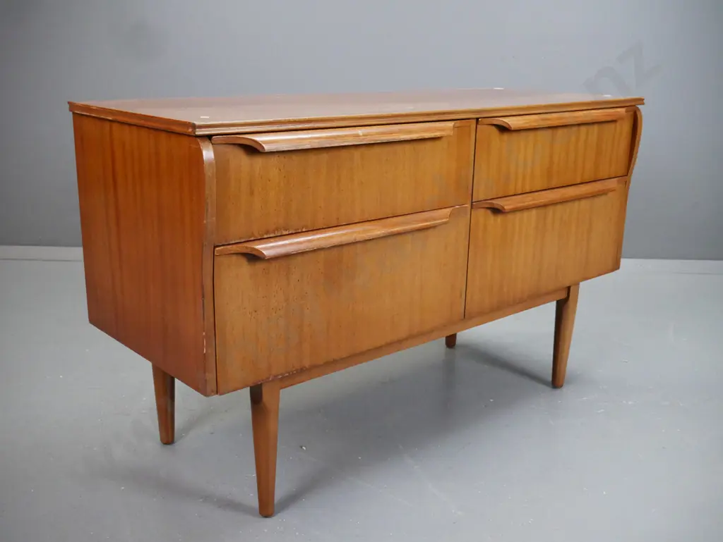 retro mahogany 4 drawer lowboy on turned tapered legs. Staining and fading to top and front. Image 1++