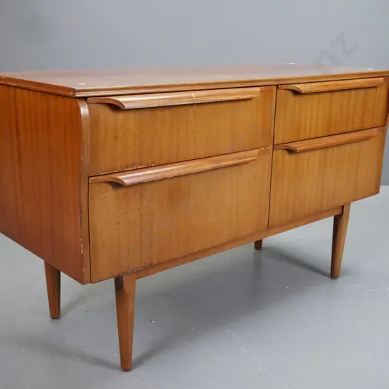 retro mahogany 4 drawer lowboy on turned tapered legs. Staining and fading to top and front.