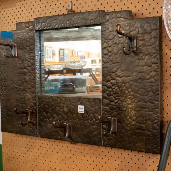 beaten copper wall mounted coat hooks and mirror