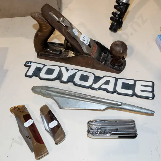 hand plane, car badges, pocket knives
