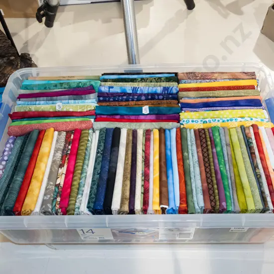 container of fabric pieces