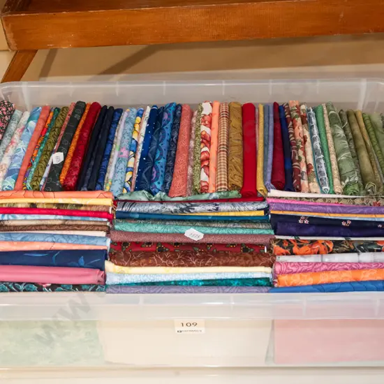 plastic tub of fabric pieces