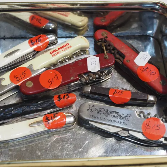 container of pocket knives