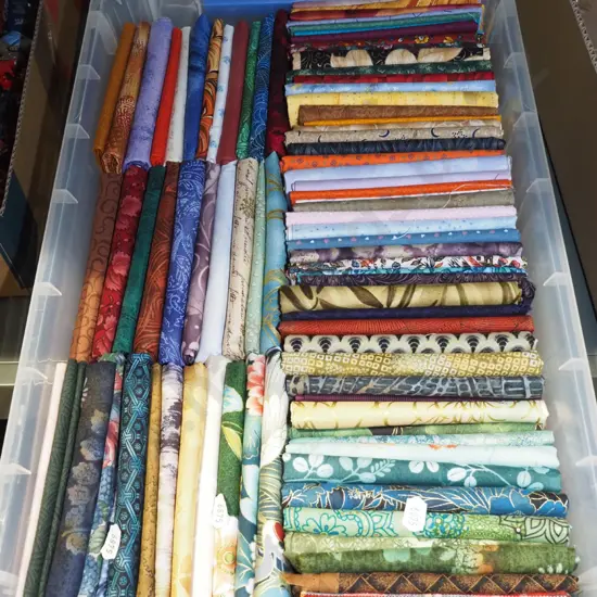box of fabric pieces
