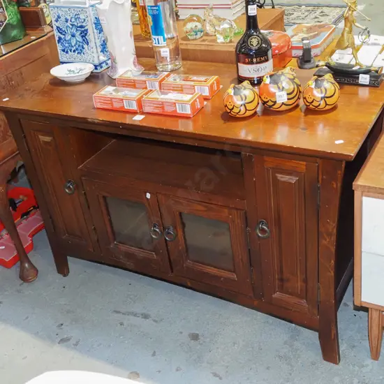 pine entertainment unit with 2 glazed doors and 2 solid pine doors covering CD storage racks