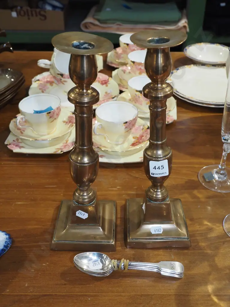 2x brass candlesticks - 1 on lean, both with dents H-290, plated teaspoons Image 1++