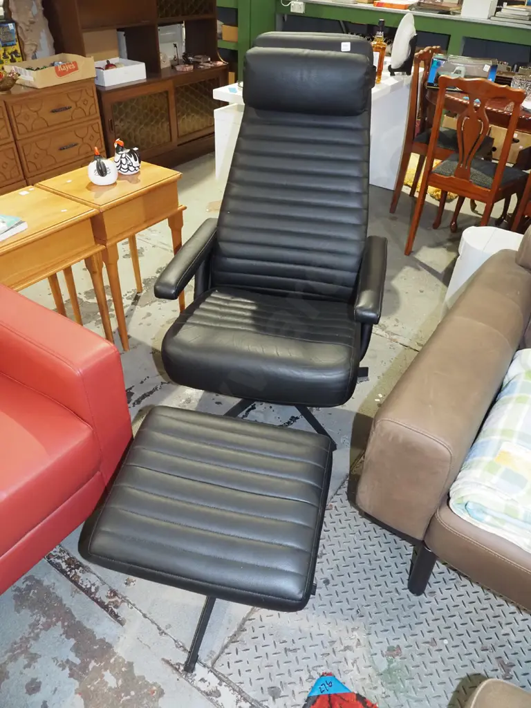 black vinyl upholstered swivel reclining armchair with matching footstool Image 1++