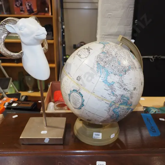 plastic based world globe - some fading, rams head sculpture