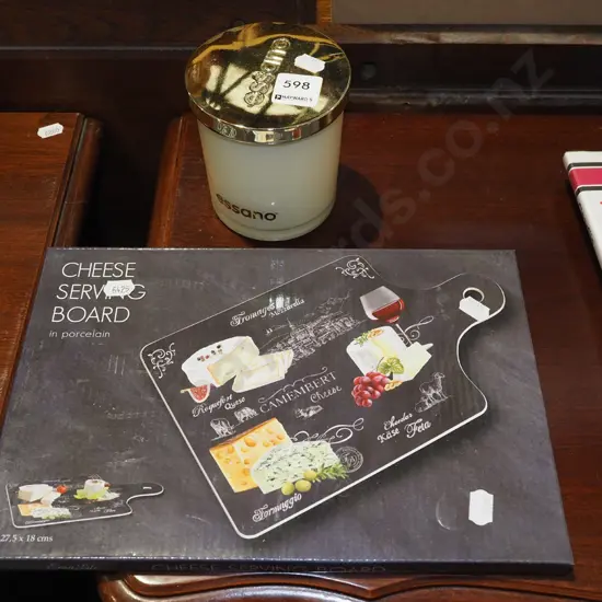 candle, cheese serving board