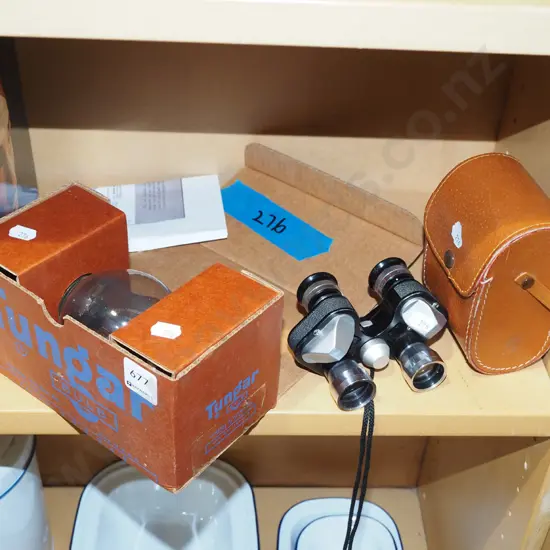 boxed GE Tungar lightbulb and a pair of compact 7x20 binoculars with leather case