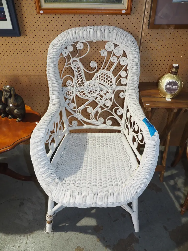 woven cane armchair with peacock design Image 1++