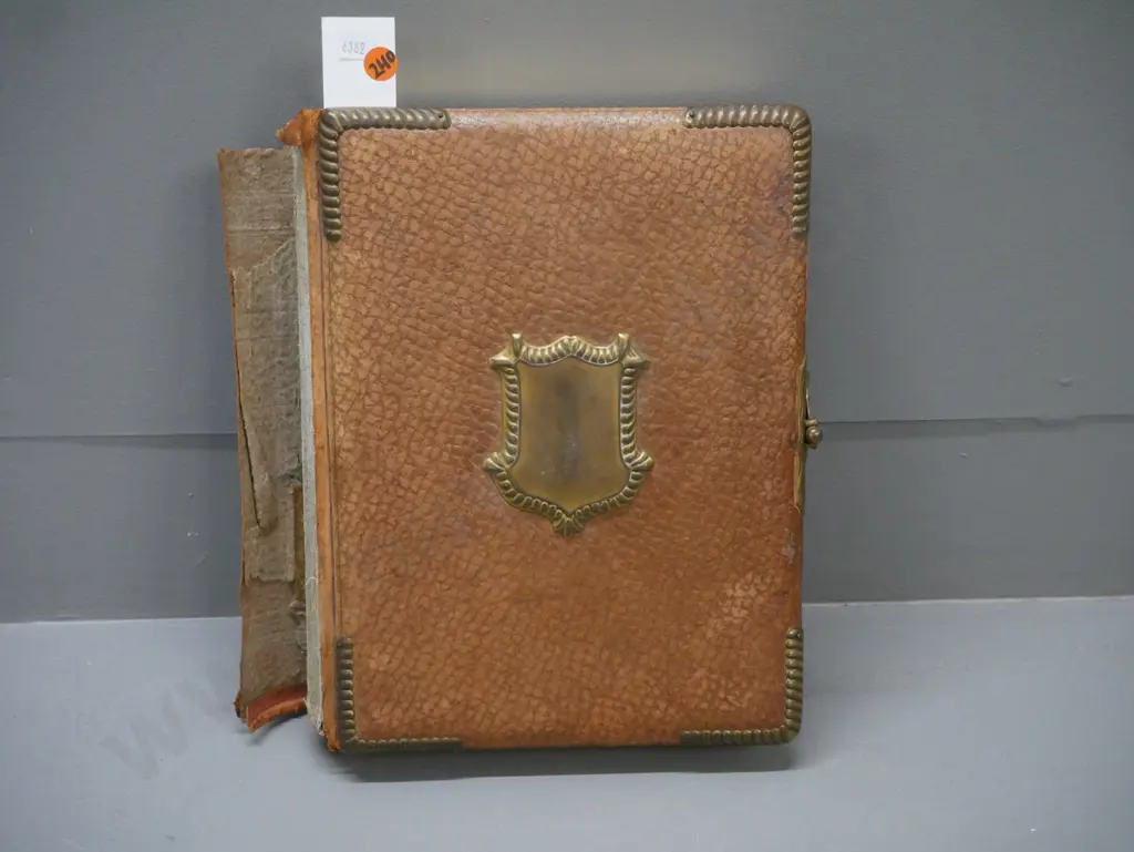 Leather-bound photo album w/ metal clasp, corners & crest. 13 pages of photographs, mechanical music box mechanism. Image 1++