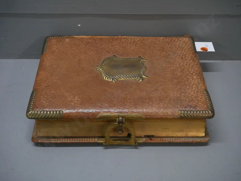 Leather-bound photo album w/ metal clasp, corners & crest. 13 pages of photographs, mechanical music box mechanism. Image 1++