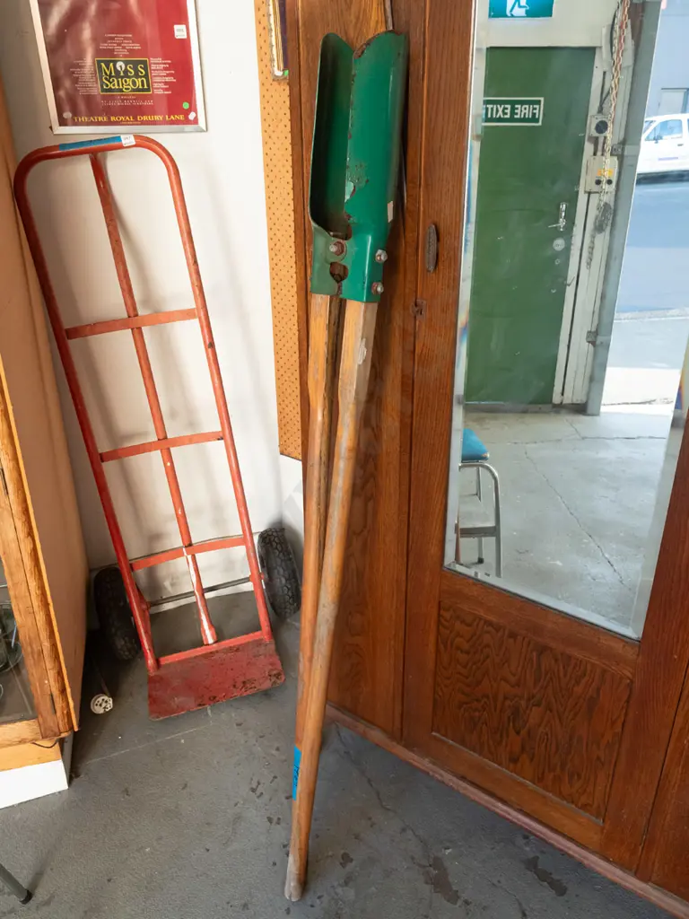 wood-handled post hole digger Image 1++