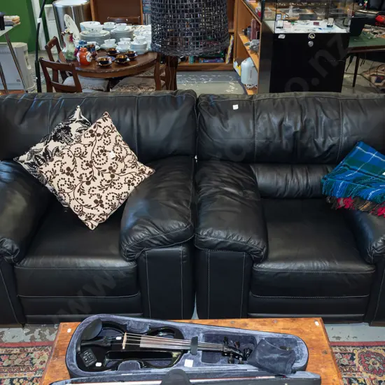 2x black vinyl armchairs