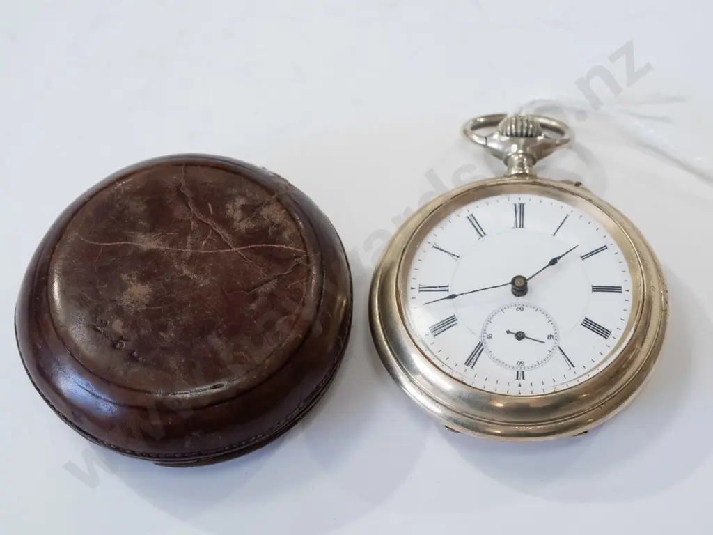 pocket watch in leather case, going Image 1++