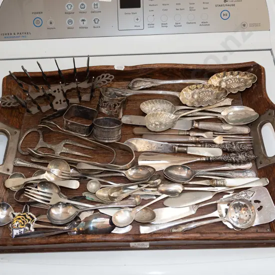 wooden tray of assorted cutlery & toast rack