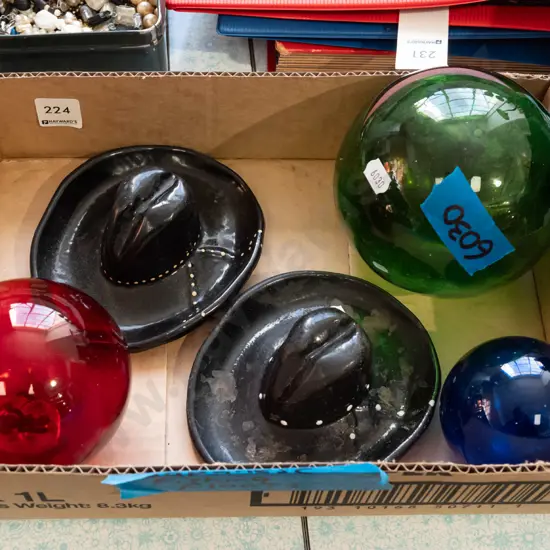 3x glass Japanese fishing floats, 2x cast iron cowboy hat ashtrays