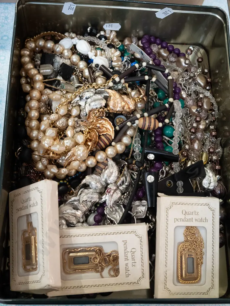 tin of costume jewellery Image 1++