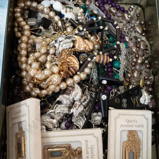 tin of costume jewellery