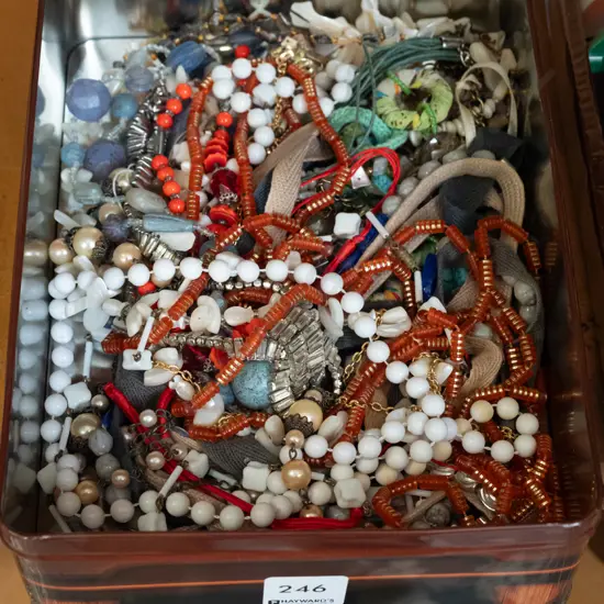 tin of costume jewellery