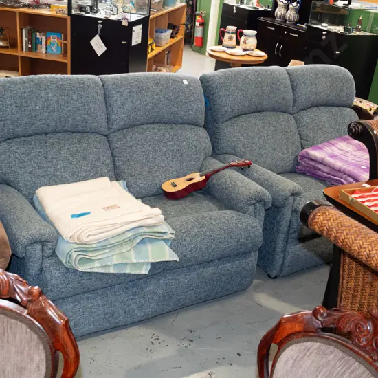 pair of blue/grey upholstered rolled arm 2 seater settees