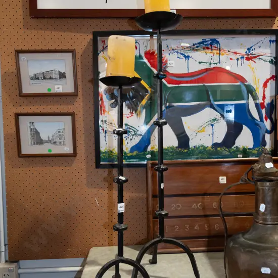 2x wrought metal candlesticks and candles Tallest H780