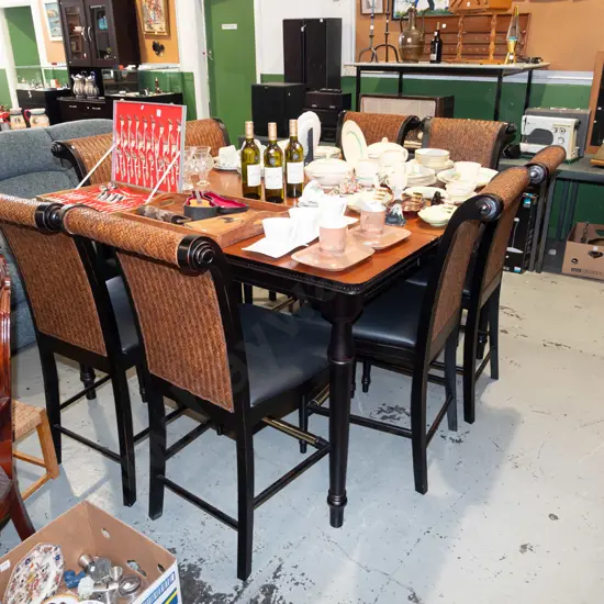 large American style extending dining table with cane back and black vinyl chairs