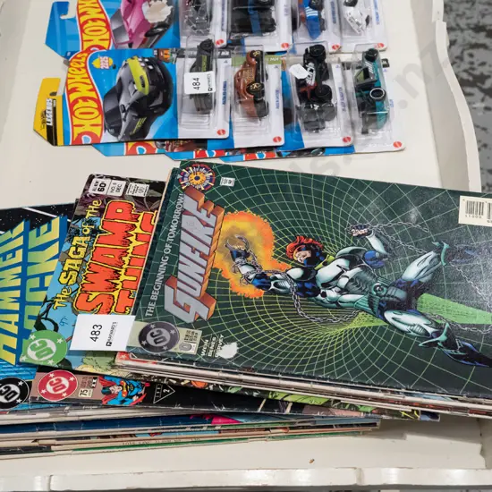 stack of DC comics