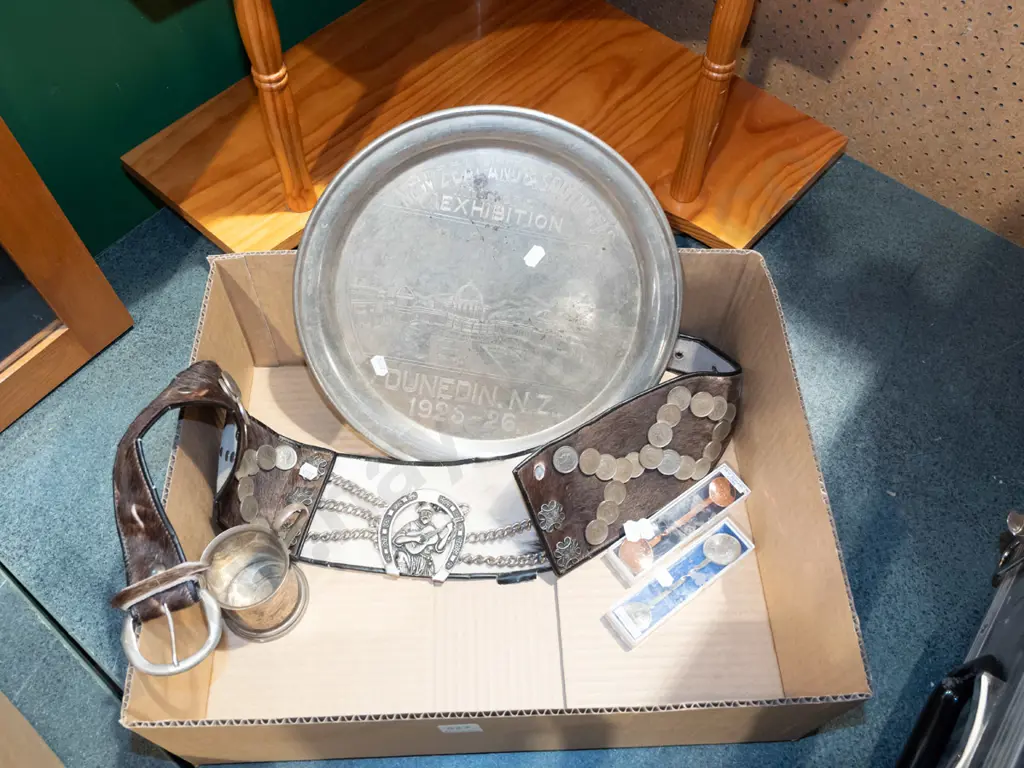 box; Dunedin Exhibition tray, teaspoons, small tankard, ornate animal fur belt Image 1++