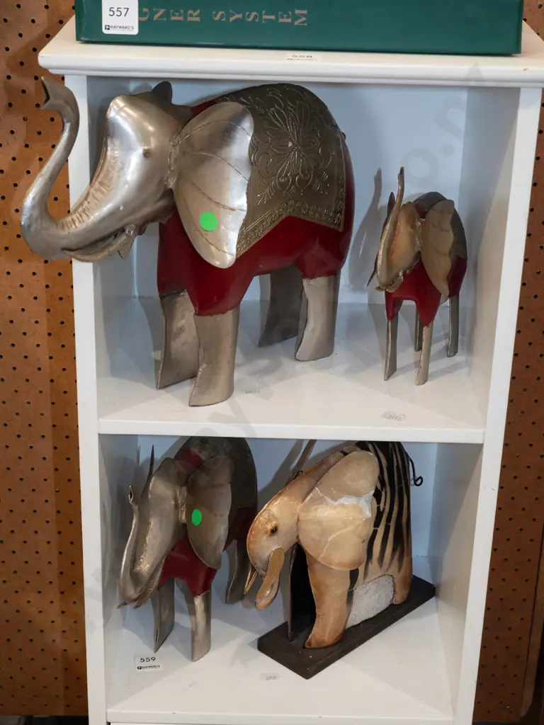 2 shelves of elephant figurines Image 1++