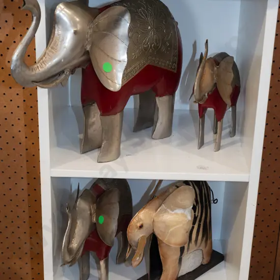 2 shelves of elephant figurines
