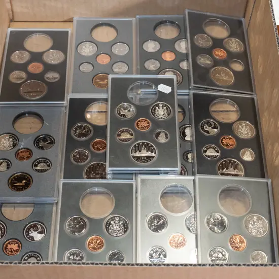 cased Canadian coin sets - missing some coins