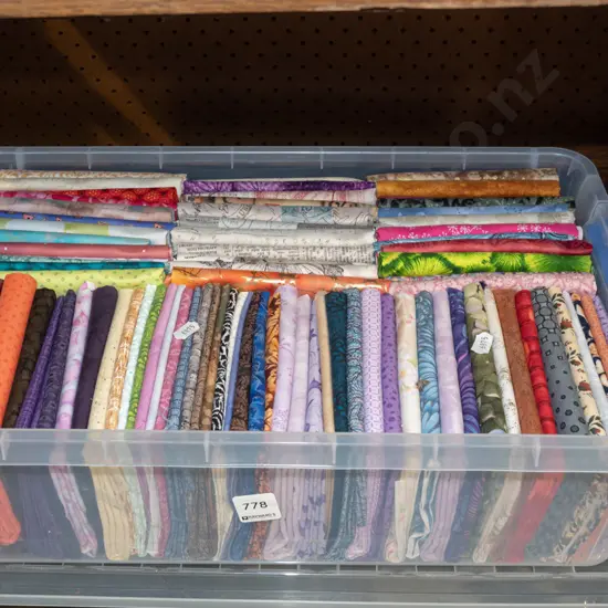 plastic tub and fabric pieces