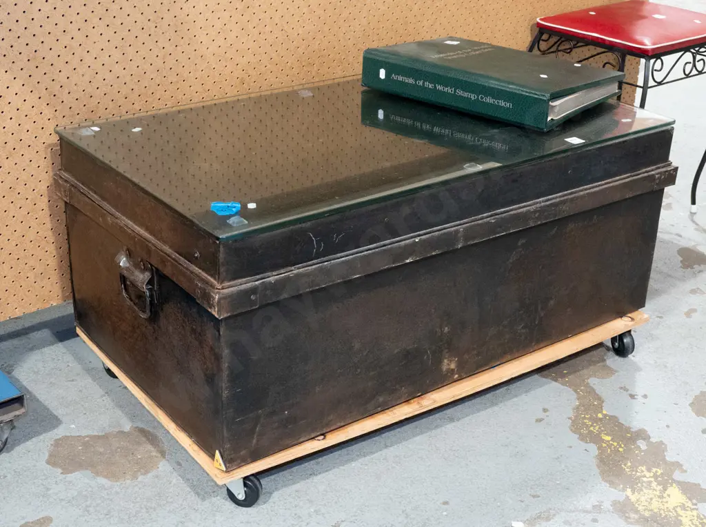 tin travellers trunk on casters with glass top to create coffee table Image 1++