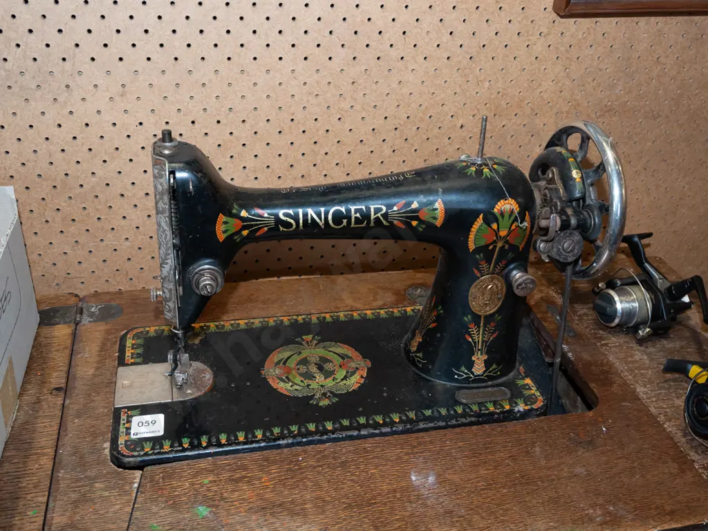 restorer's Singer treadle sewing machine with original belt - signs of age and wear Image 1++