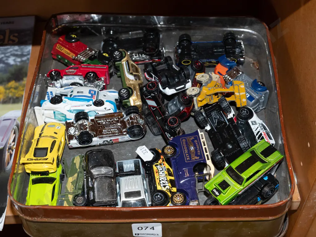 tin of toy vehicles Image 1++