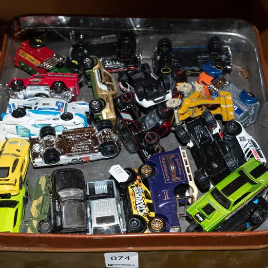 tin of toy vehicles