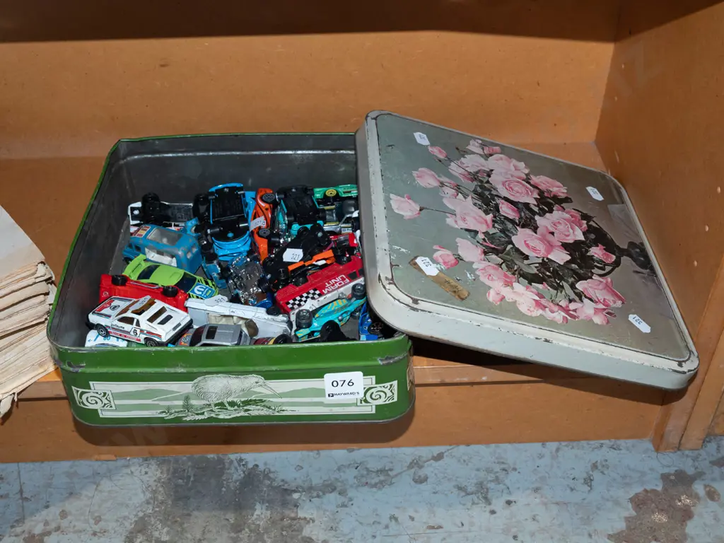 tin of toy vehicles Image 1++