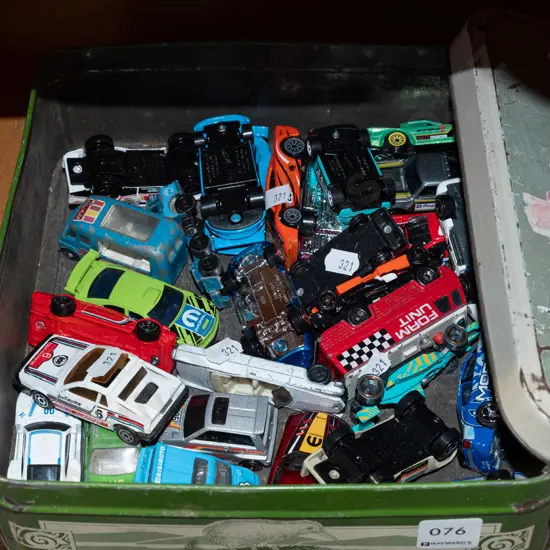 tin of toy vehicles